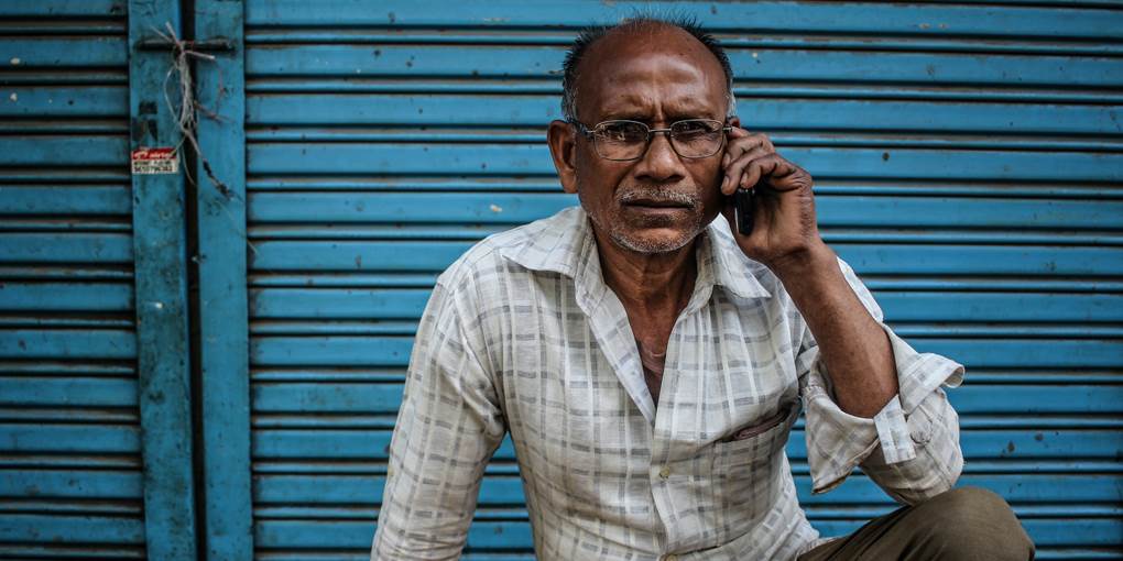 Man on a phone - blue background